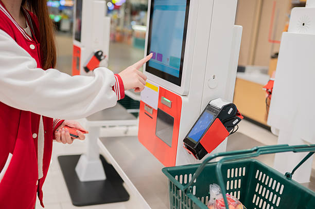 closeup hand self check out make payment touching the screen